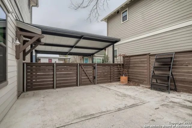 a view of an empty room with furniture