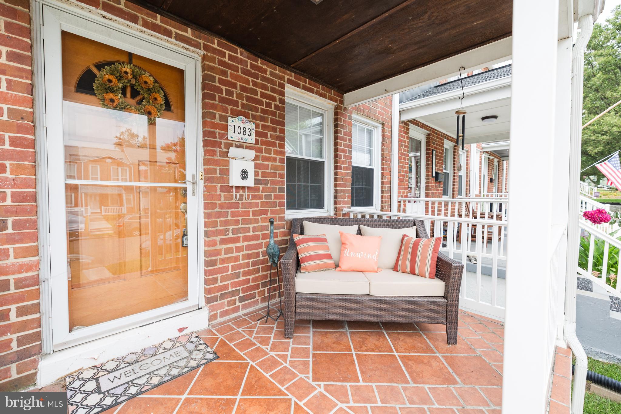 1083 Elm Road Baltimore, MD 21227 - Photo 3 of 33 a outdoor living space with patio furniture and potted plant