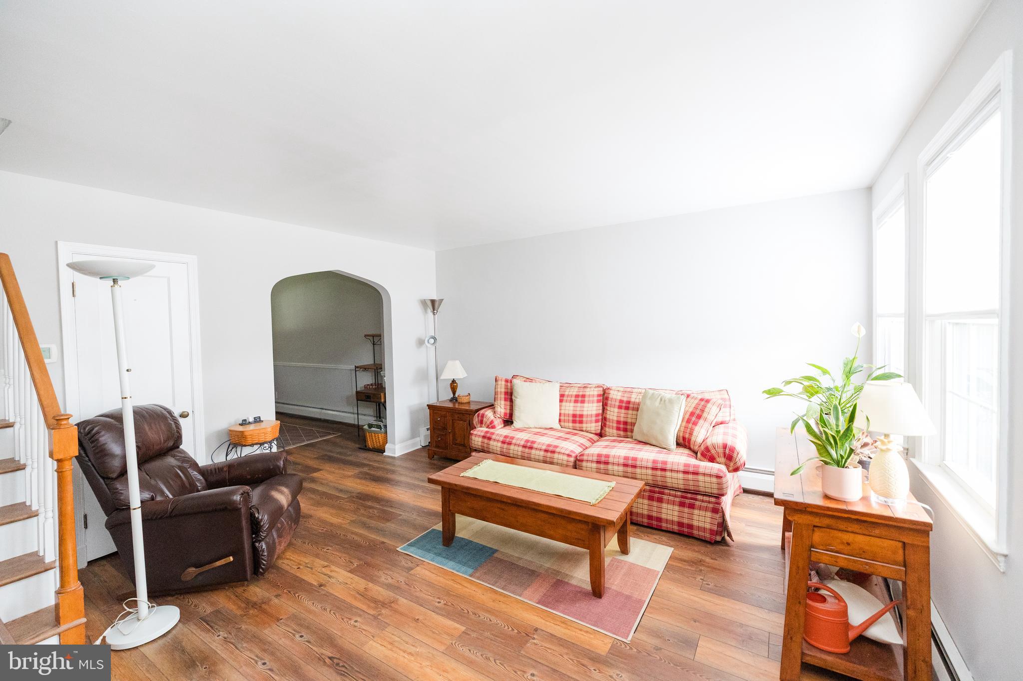 1083 Elm Road Baltimore, MD 21227 - Photo 5 of 33 a living room with furniture and a potted plant