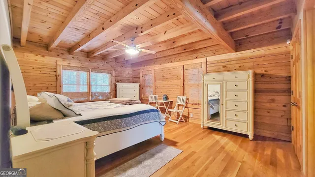 a bed room with a bed and a window