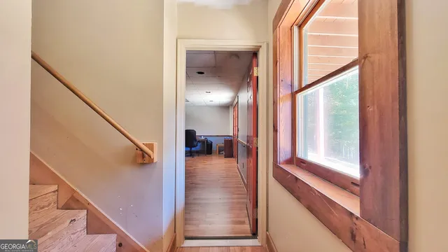 a kitchen with white cabinets and appliances