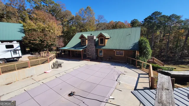 a view of a terrace with couches and wooden floor