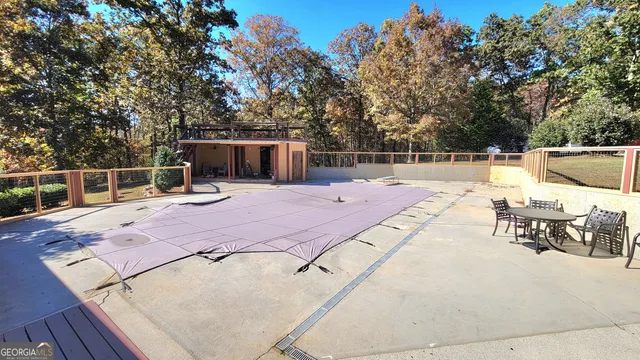 a view of a backyard with sitting area
