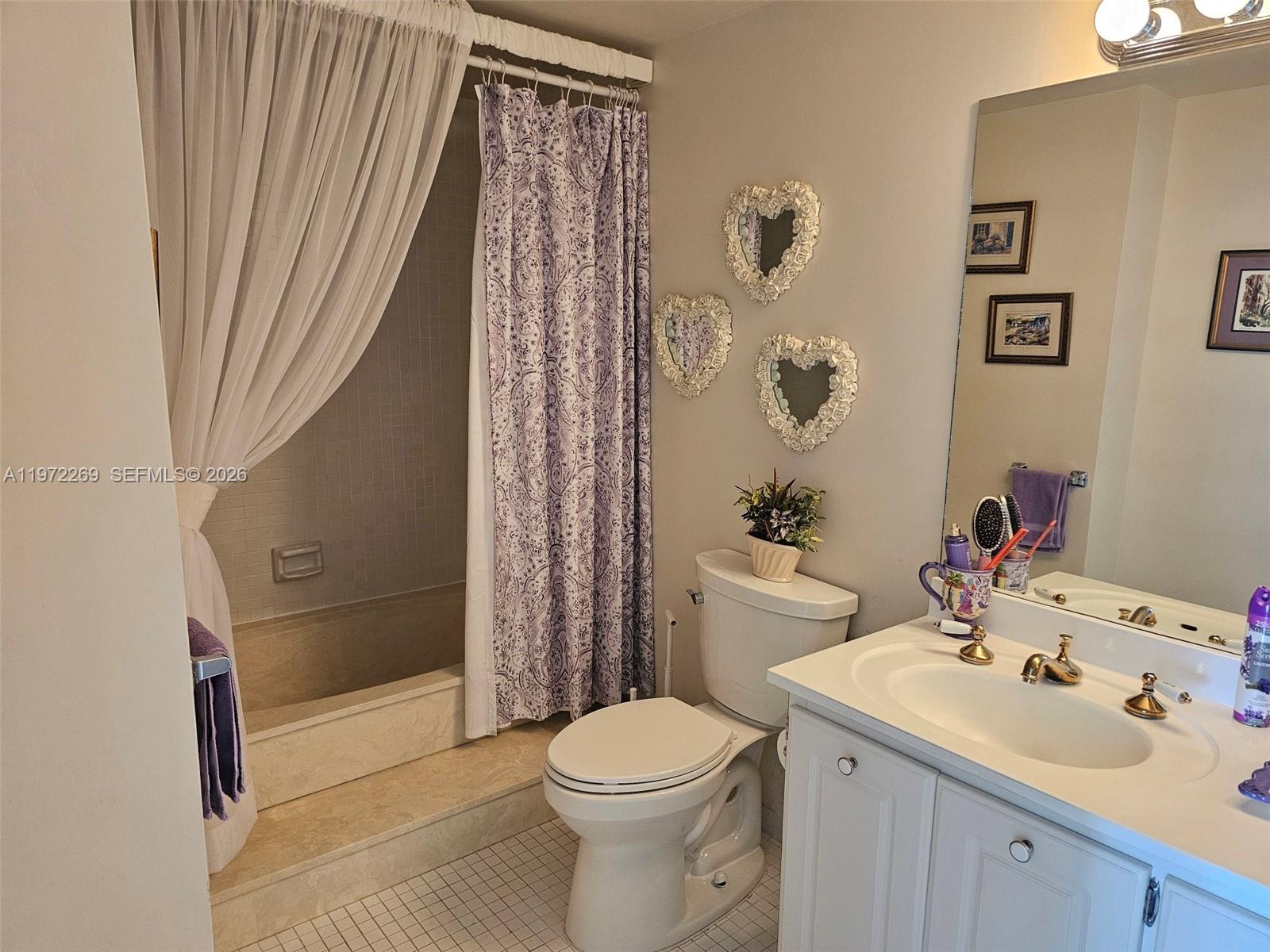 3850 Washington Street, Unit 516 Hollywood, FL 33021 - Photo 10 of 17 a bathroom with a sink toilet and shower