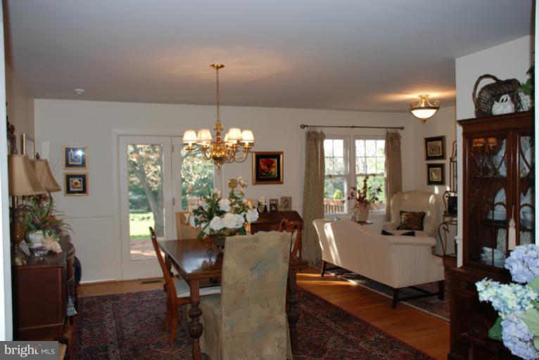 2302 Furnace Road Fallston, MD 21047 - Photo 21 of 23 a view of a dining room with furniture window and wooden floor