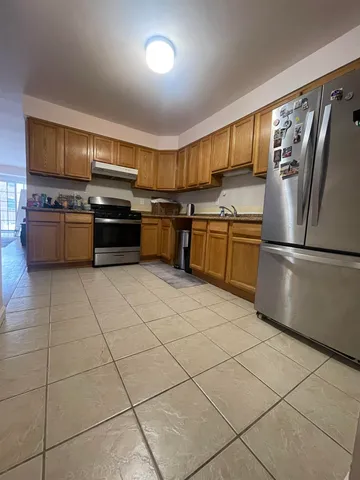 a kitchen with stainless steel appliances and cabinets