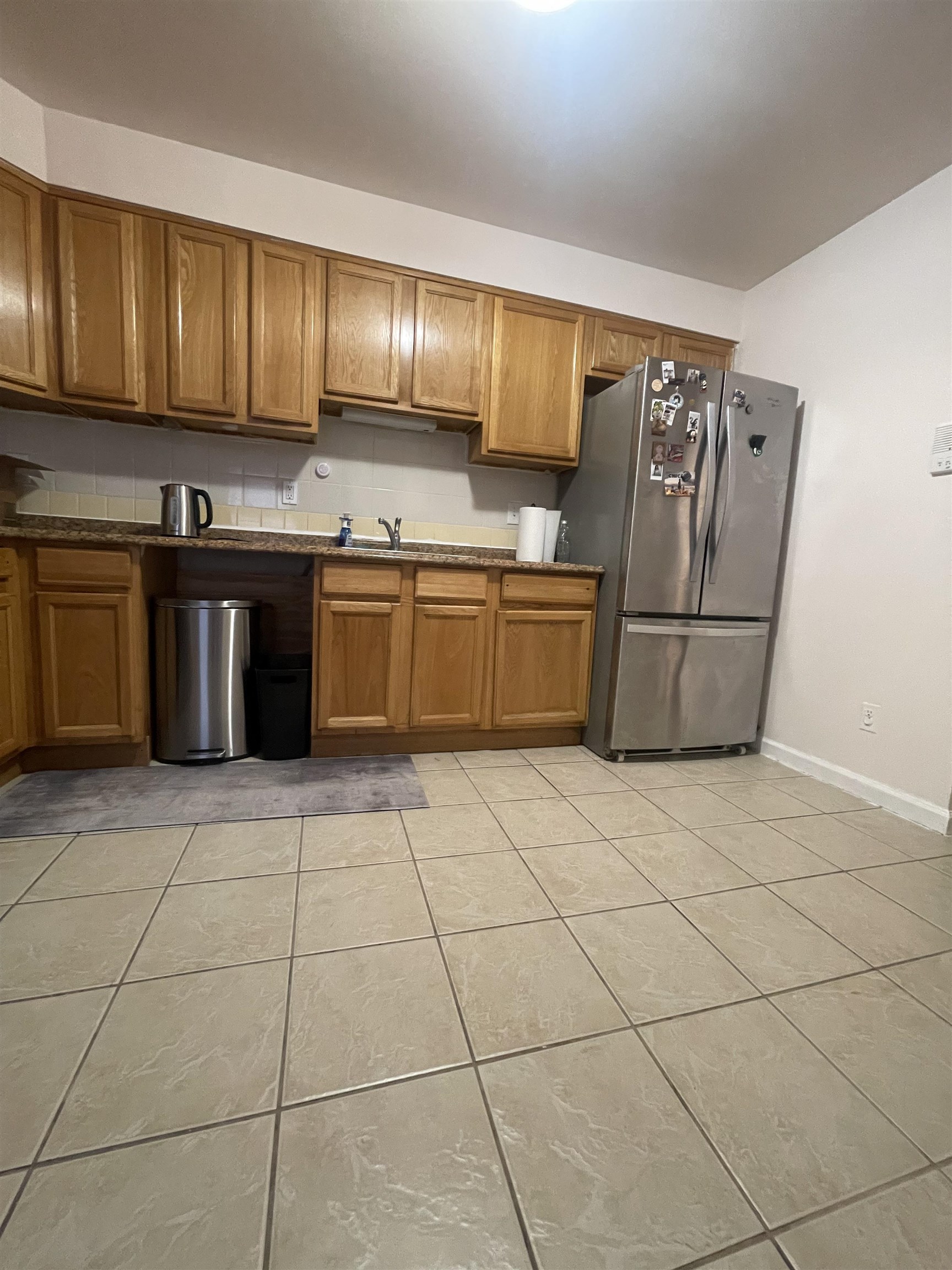 225 Belvidere Avenue, Unit 2 Jersey City, NJ 07306 - Photo 13 of 18 a kitchen with stainless steel appliances granite countertop a stove a sink and a refrigerator