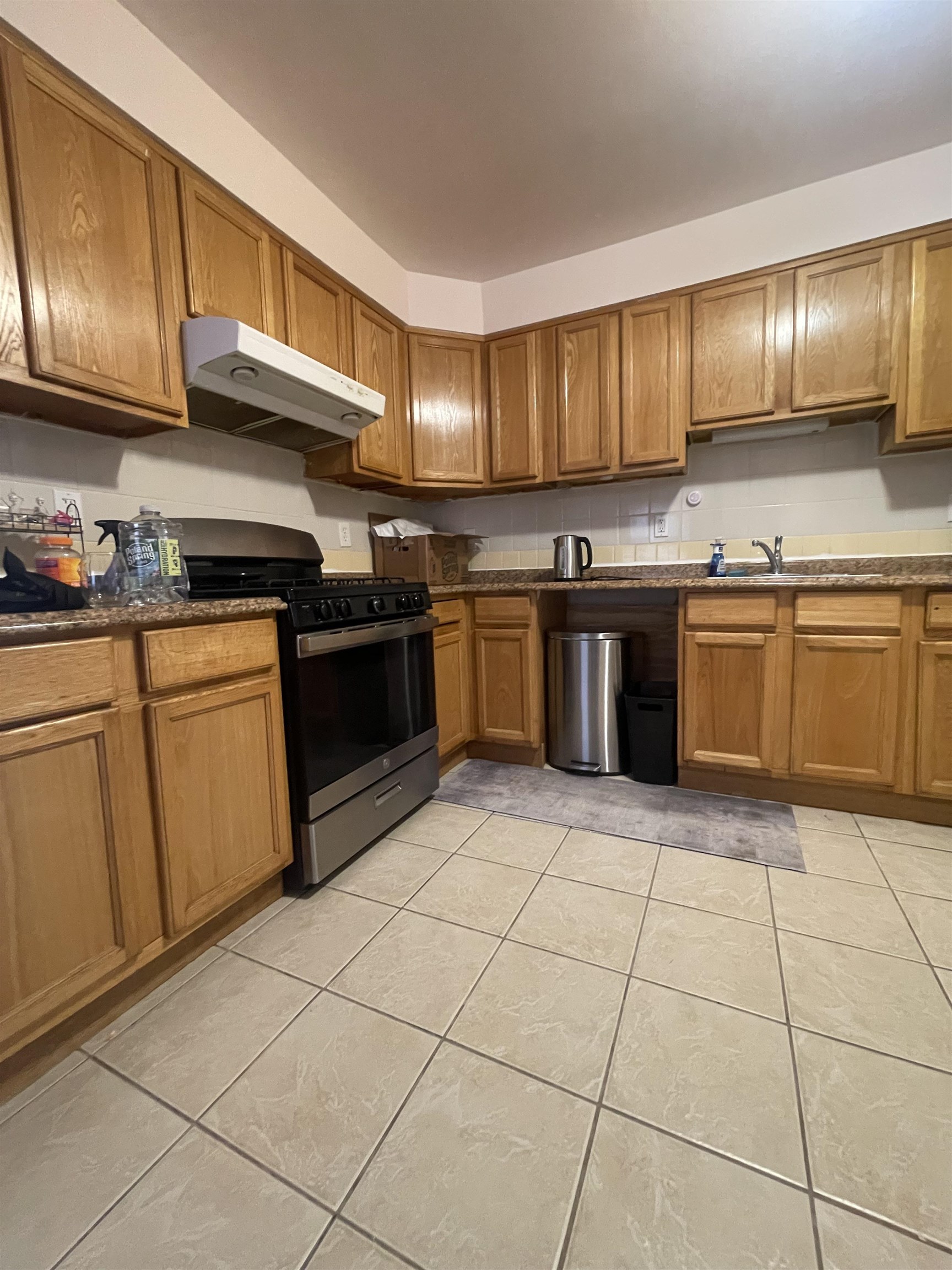 225 Belvidere Avenue, Unit 2 Jersey City, NJ 07306 - Photo 14 of 18 a kitchen with stainless steel appliances granite countertop a stove a sink dishwasher and a refrigerator