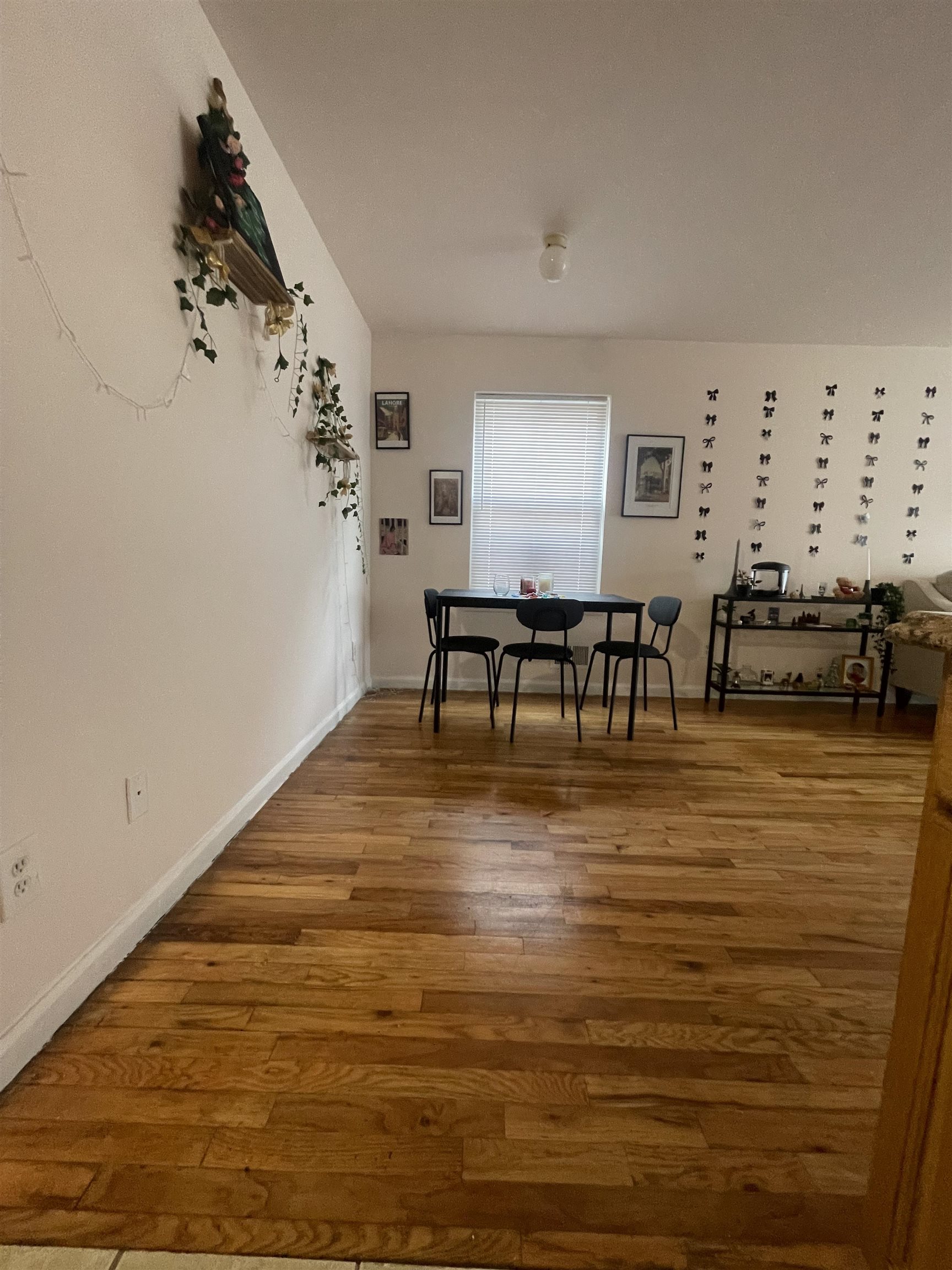 225 Belvidere Avenue, Unit 2 Jersey City, NJ 07306 - Photo 15 of 18 a living room with furniture floor to ceiling window and wooden floor