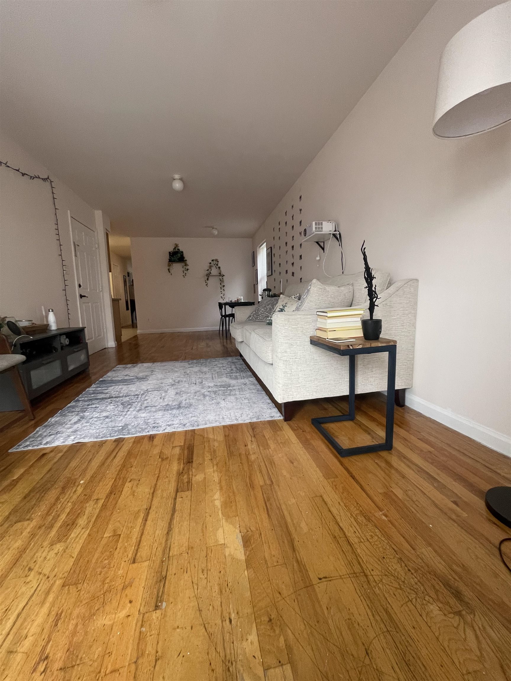 225 Belvidere Avenue, Unit 2 Jersey City, NJ 07306 - Photo 16 of 18 a bedroom with a bed and wooden floor