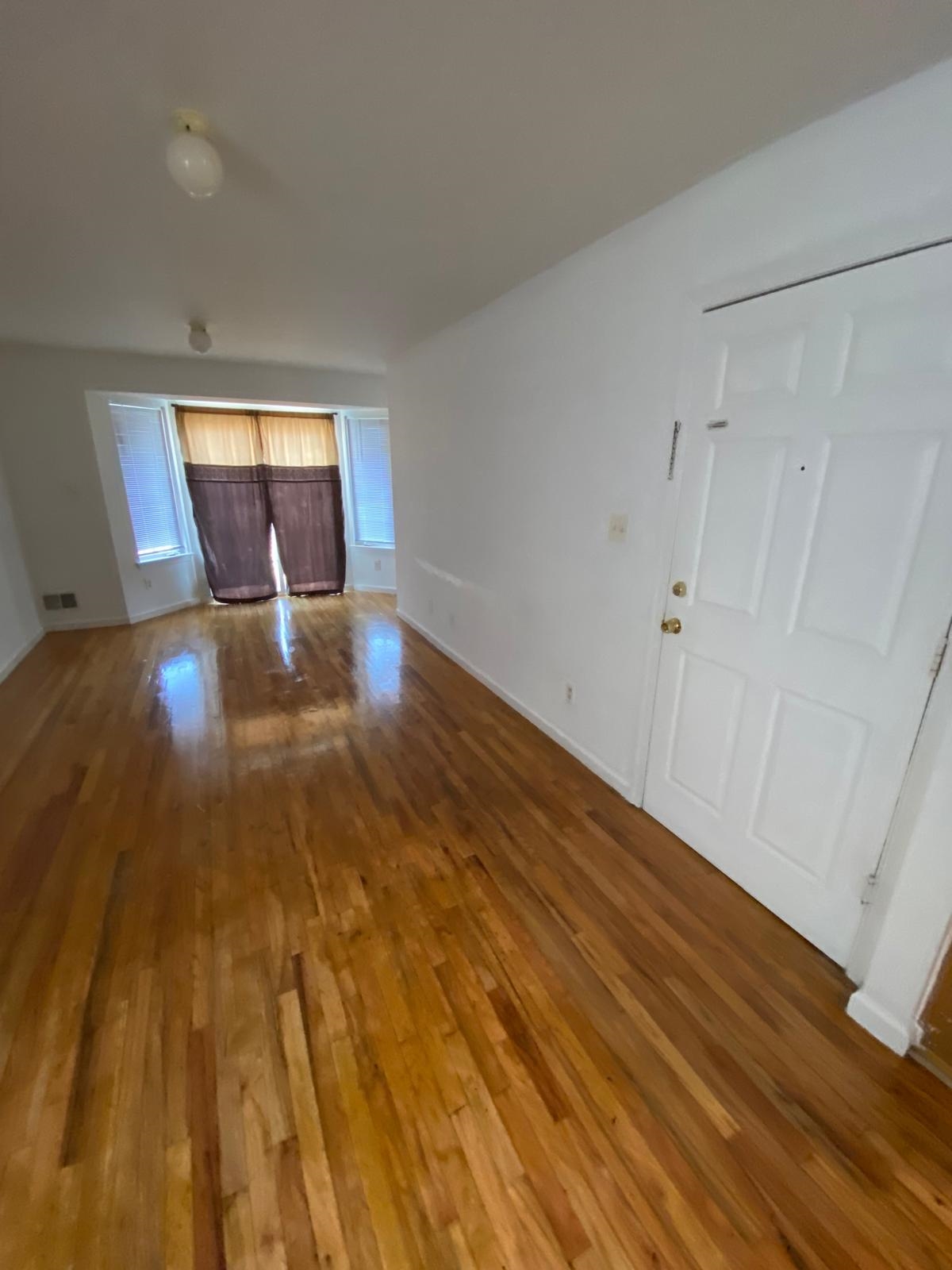 225 Belvidere Avenue, Unit 2 Jersey City, NJ 07306 - Photo 6 of 18 a view of empty room with wooden floor