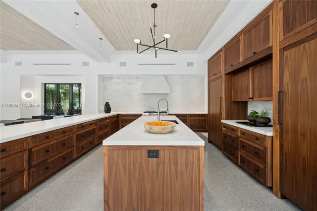 a living room with furniture ceiling fan and a rug