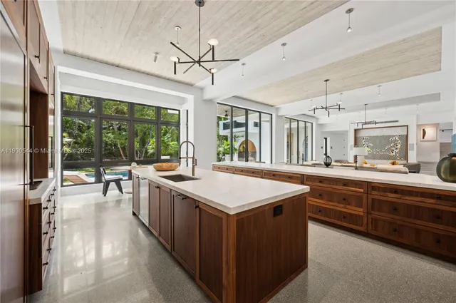 a bedroom with furniture and a large window