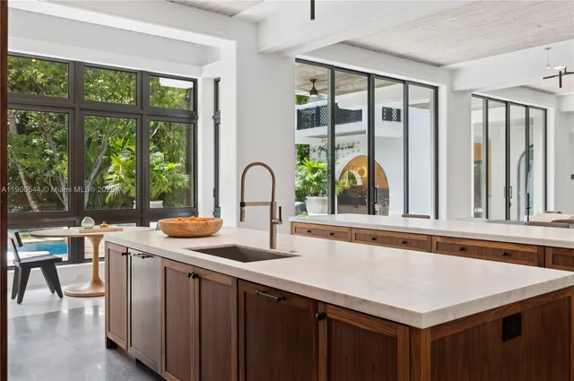 a bedroom with a bed lamps and wooden floor