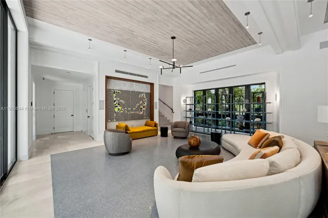 a bedroom with a large bed and a large window