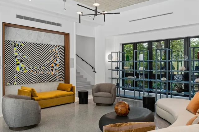 a bedroom with a large bed and a large window