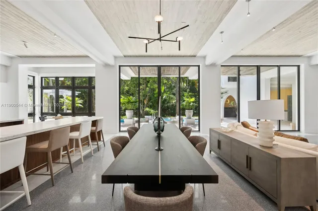 a bedroom with bed and wooden floor