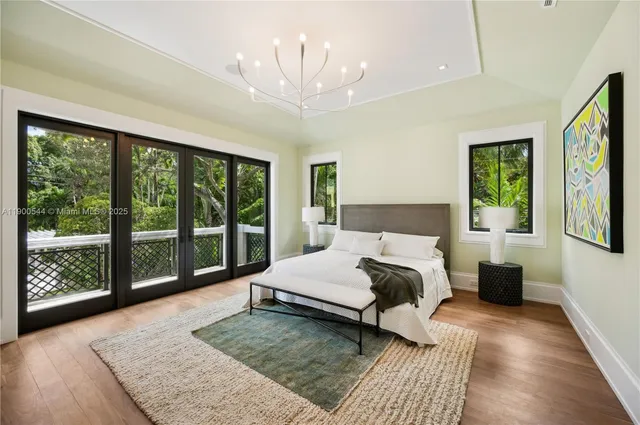 a view of a house with backyard porch and sitting area