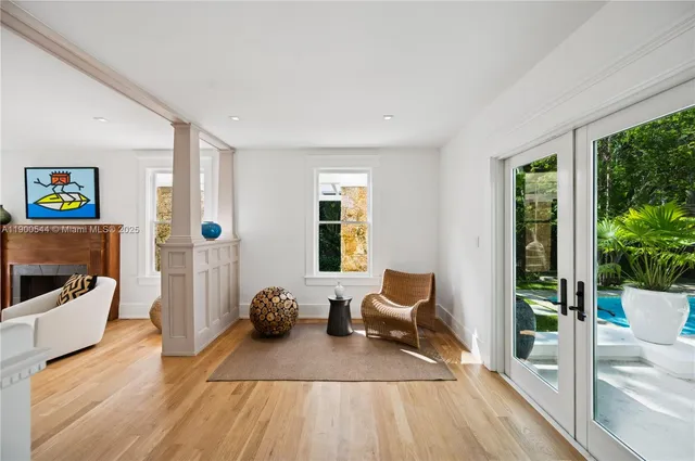 a kitchen with kitchen island a counter top space a sink stainless steel appliances and cabinets
