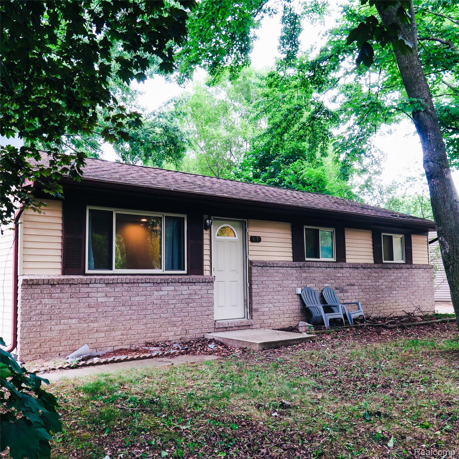 3231 West Utica Road Utica, MI 48317 - Photo 1 of 20 Light-colored siding exterior with a dark-trimmed roofline