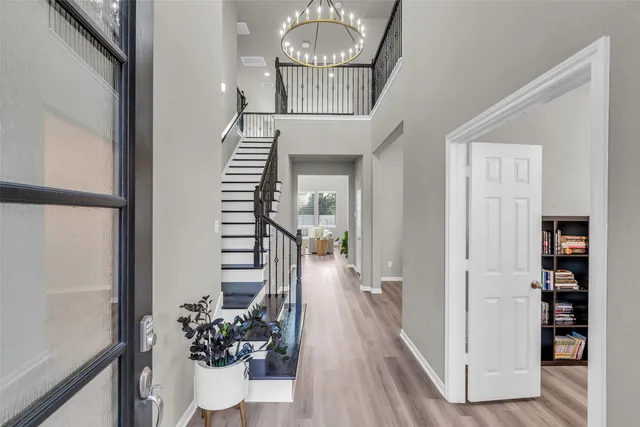 a living room with furniture and a book shelf