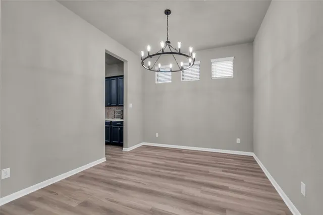 wooden floor in a hall with an entryway