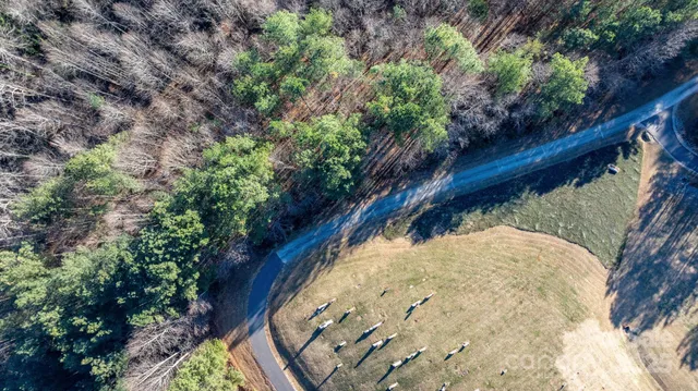 a view of a wooden house with a yard
