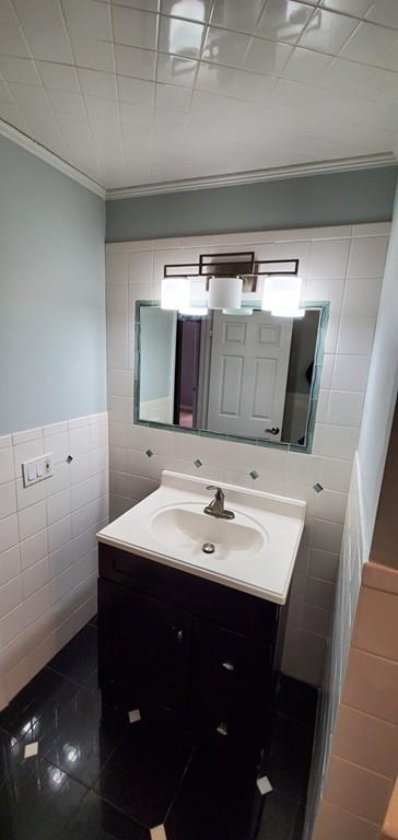 211 New Boston Road Sturbridge, MA 01566 - Photo 12 of 23 a bathroom with a sink and a mirror