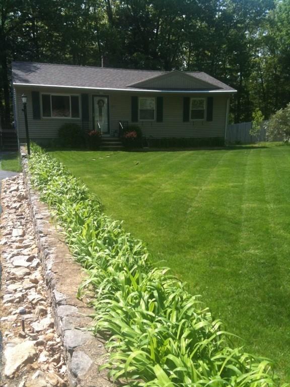 211 New Boston Road Sturbridge, MA 01566 - Photo 2 of 23 a front view of a house with garden
