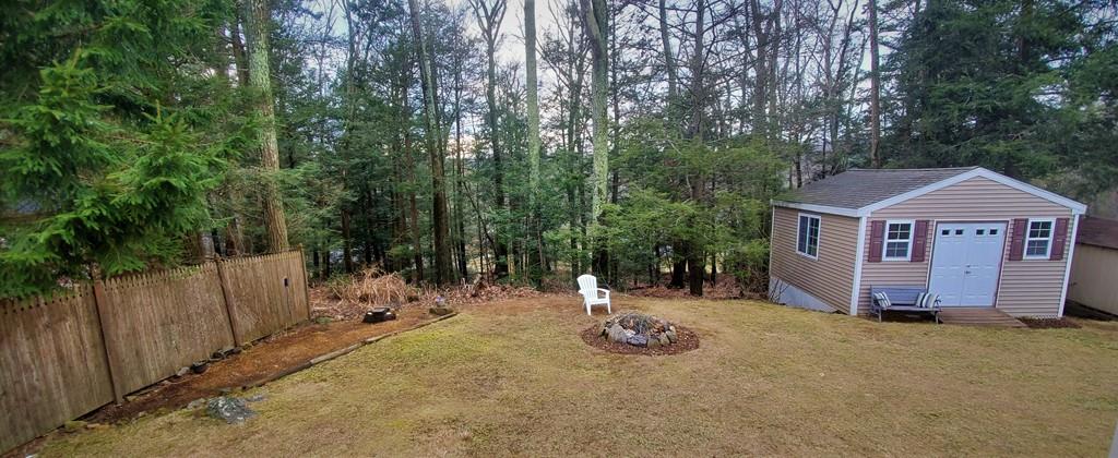 211 New Boston Road Sturbridge, MA 01566 - Photo 23 of 23 a view of a house with backyard and trees