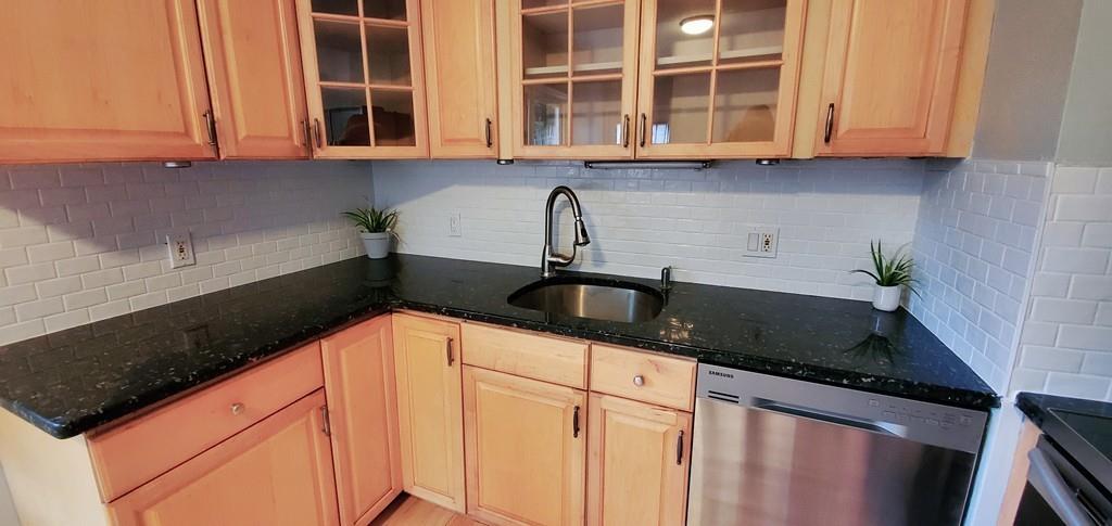 211 New Boston Road Sturbridge, MA 01566 - Photo 10 of 23 a kitchen with granite countertop a sink and a stove