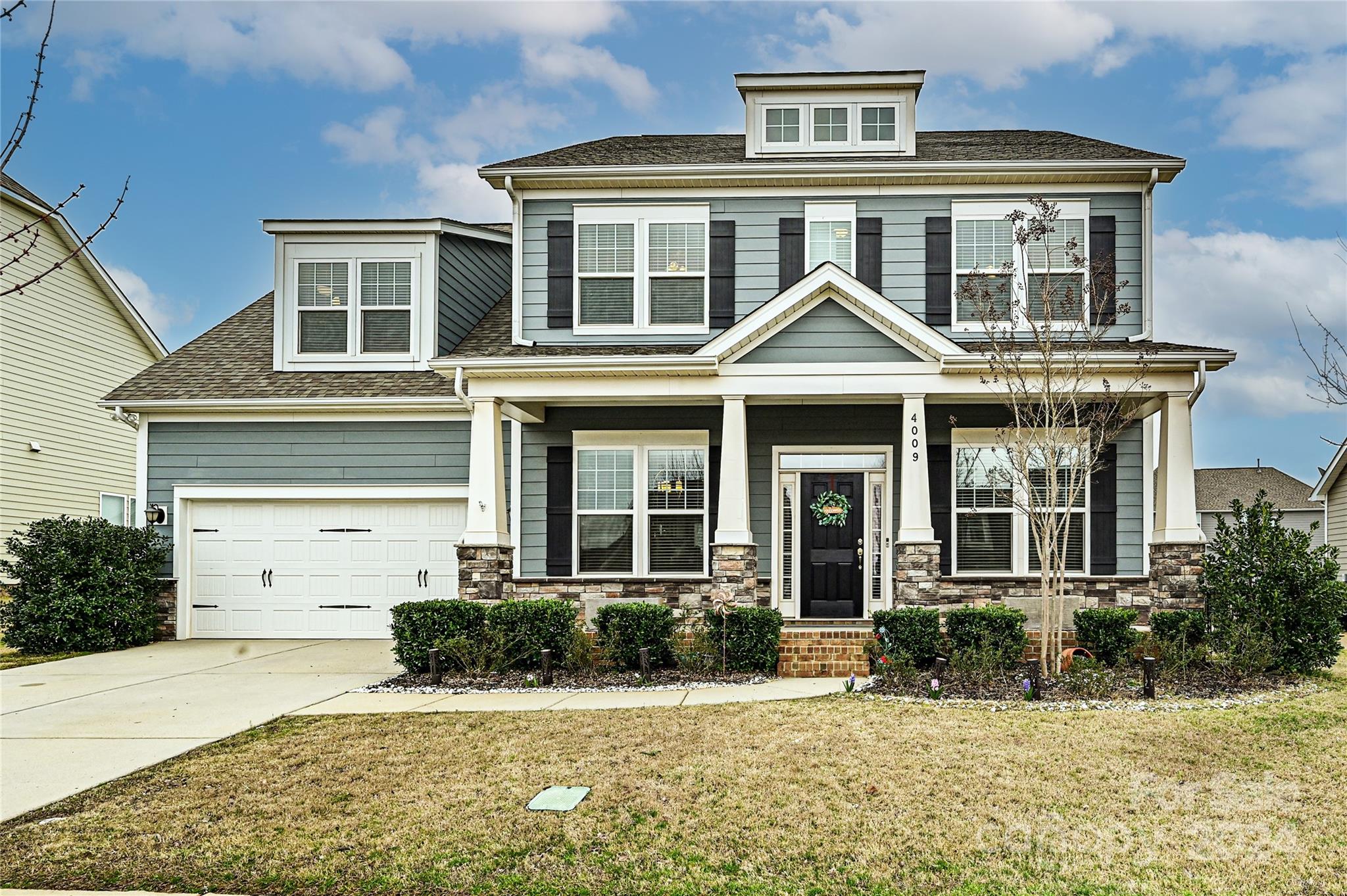 front view of a house with a yard