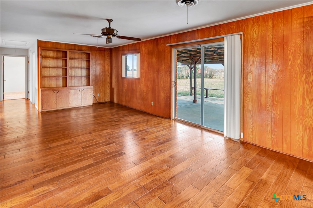 711 Northgate Road Victoria, TX 77904 - Photo 12 of 37 wooden floor in an empty room and a window