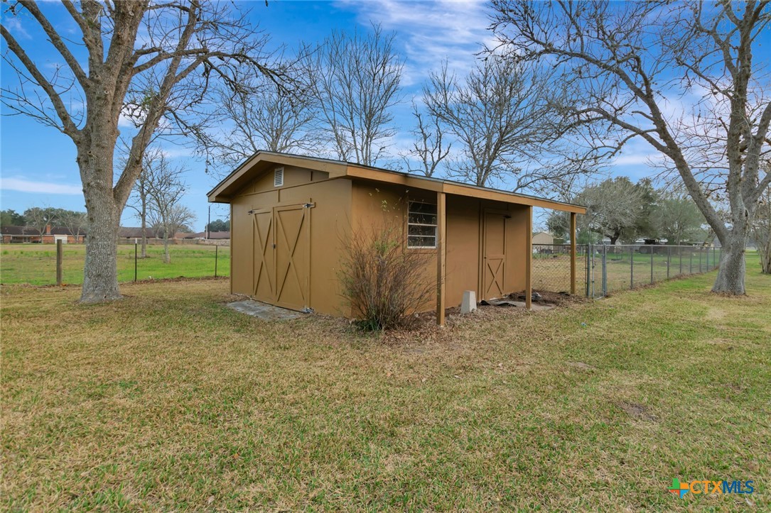 711 Northgate Road Victoria, TX 77904 - Photo 35 of 37 a house with trees in the background