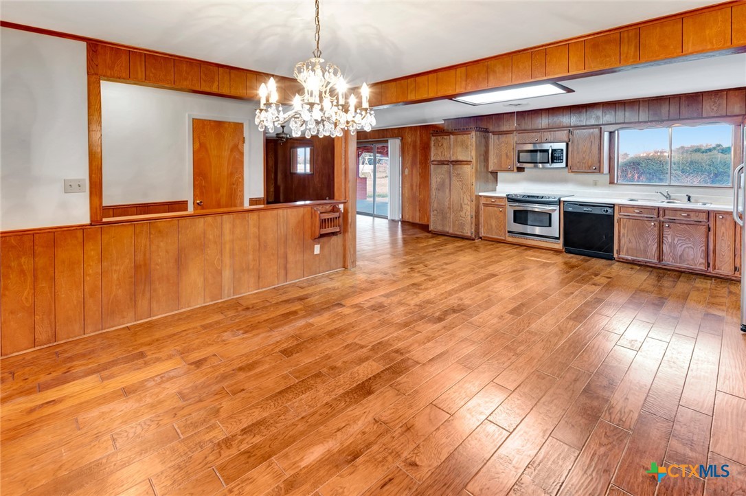 711 Northgate Road Victoria, TX 77904 - Photo 6 of 37 a view of a kitchen with a sink and dishwasher cabinets