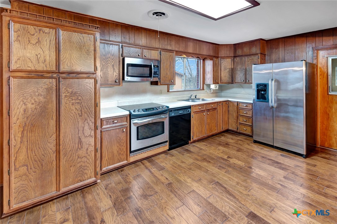 711 Northgate Road Victoria, TX 77904 - Photo 9 of 37 a kitchen with stainless steel appliances granite countertop a refrigerator and a stove top oven