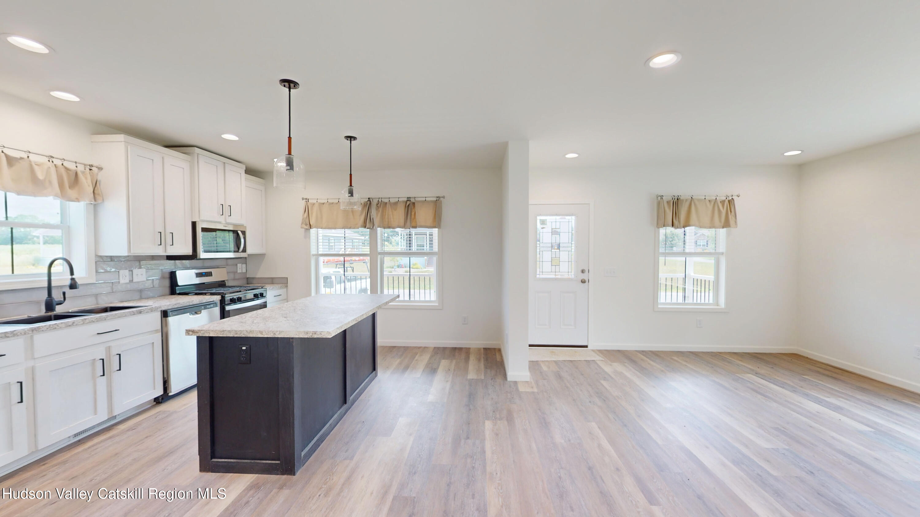 19 Mahoney Road Stuyvesant, NY 12173 - Photo 10 of 32 a kitchen with a sink a window stainless steel appliances and cabinets