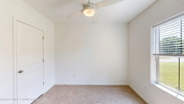 a view of wooden floor and windows in a room