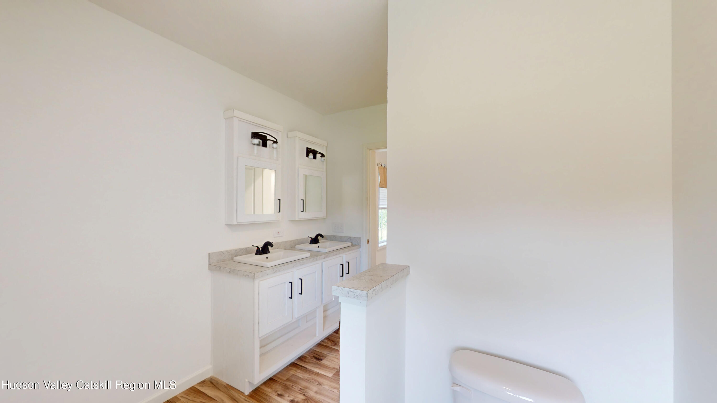 19 Mahoney Road Stuyvesant, NY 12173 - Photo 28 of 32 a bathroom with a sink toilet and mirror