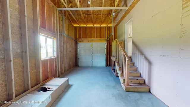 a view of an empty room with stairs