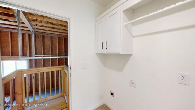 a view of a hardwood & an entryway