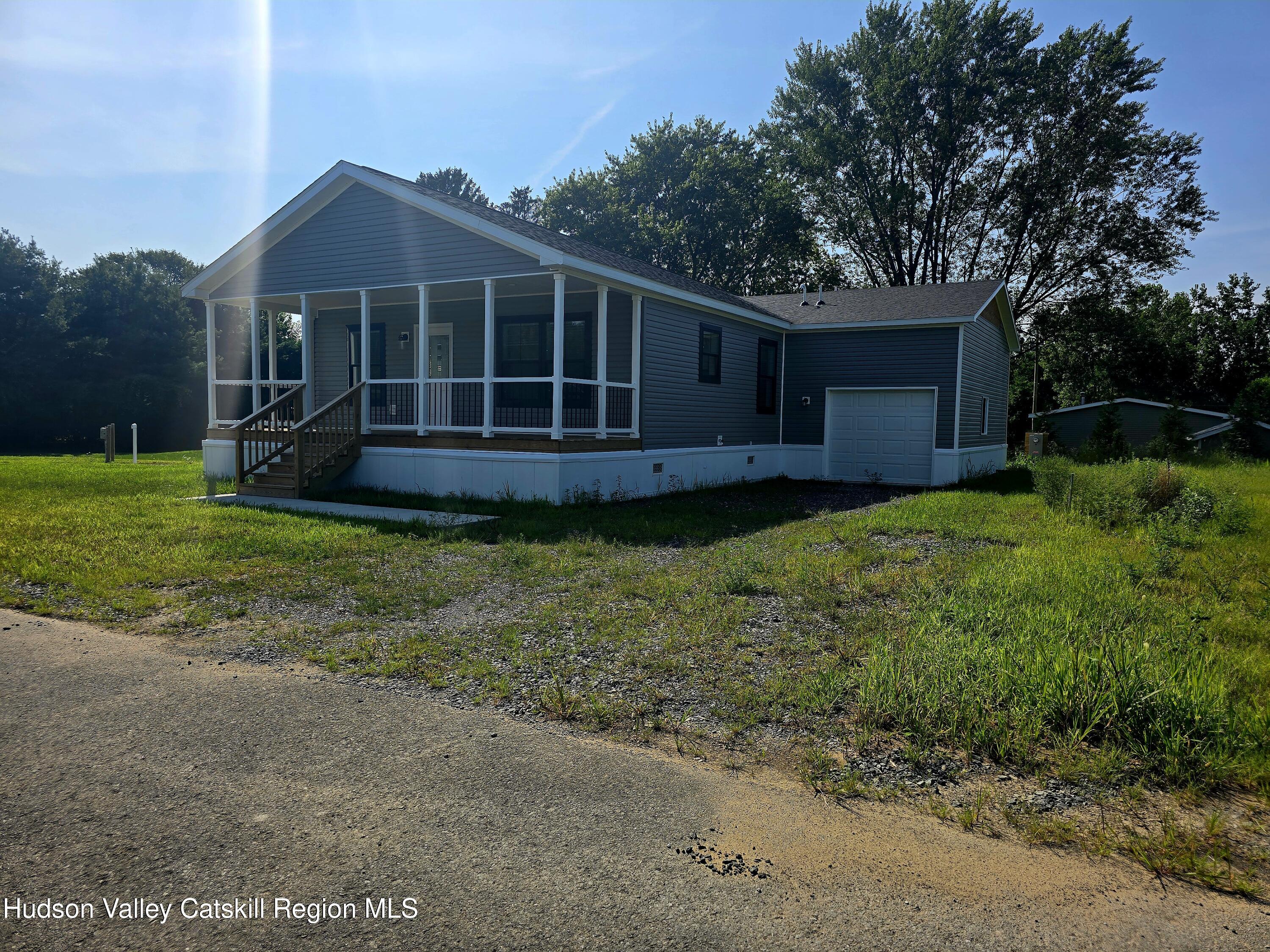 19 Mahoney Road Stuyvesant, NY 12173 - Photo 31 of 32 a view of a house with a yard and sitting area