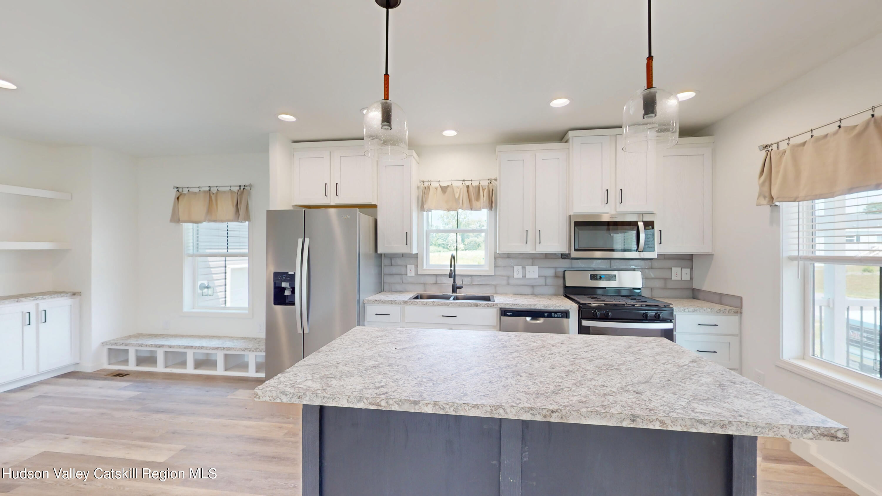 19 Mahoney Road Stuyvesant, NY 12173 - Photo 4 of 32 a kitchen with stainless steel appliances granite countertop a sink refrigerator and microwave