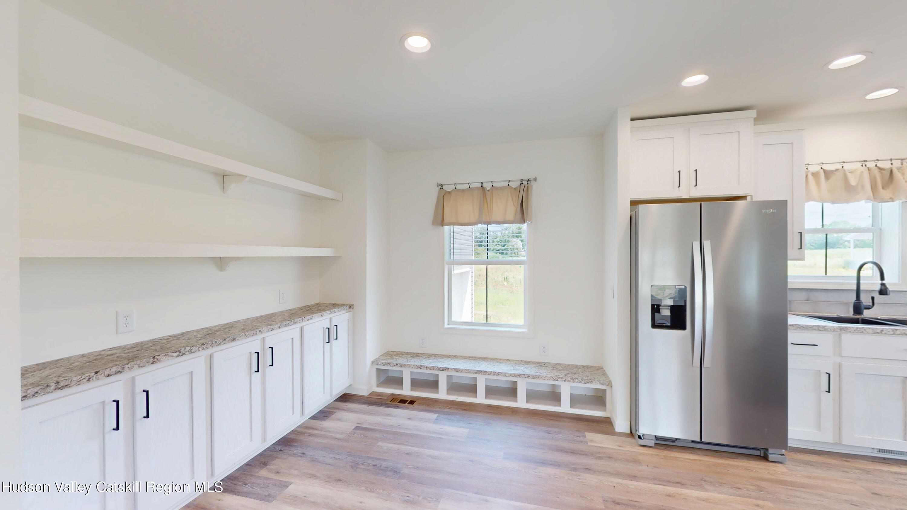 19 Mahoney Road Stuyvesant, NY 12173 - Photo 9 of 32 a kitchen with stainless steel appliances granite countertop a refrigerator a sink and white cabinets