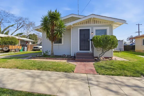 a front view of a house with garden