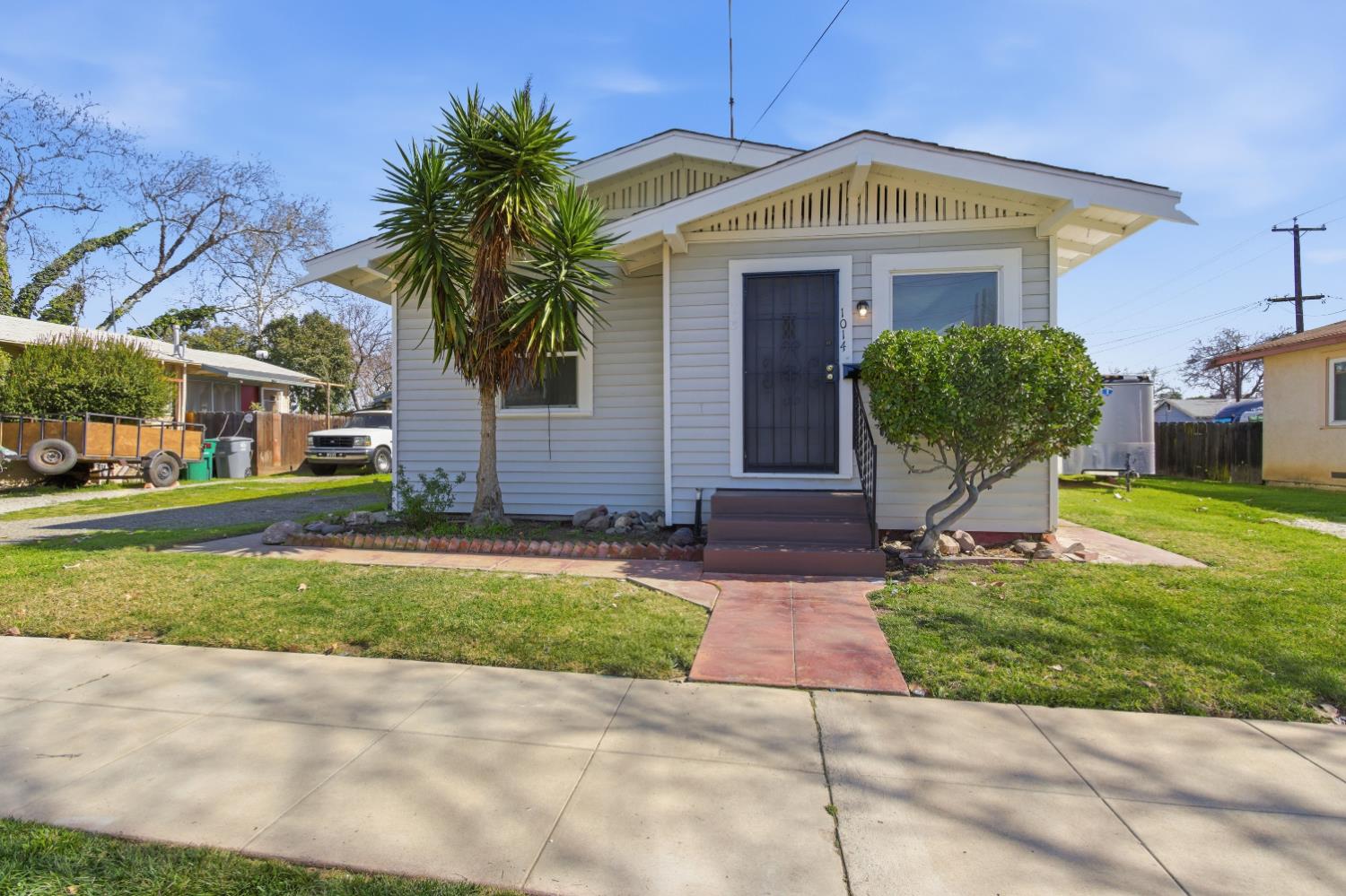 a front view of a house with garden