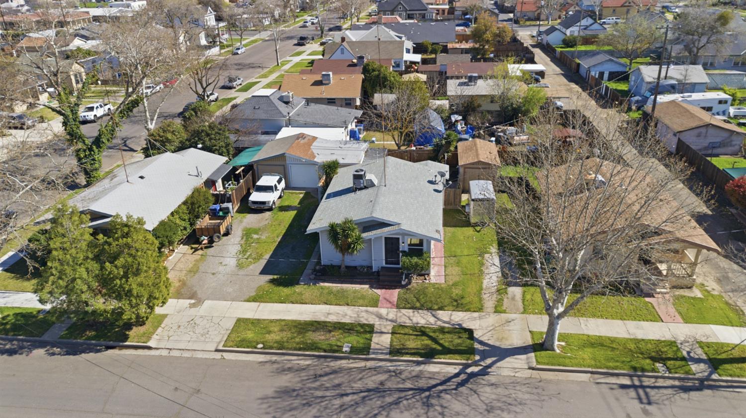 1014 3rd Street Los Banos, CA 93635 - Photo 20 of 21 an aerial view of multiple houses with yard