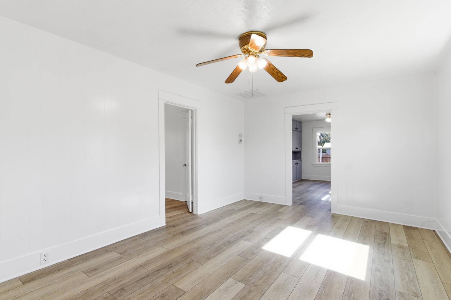 1014 3rd Street Los Banos, CA 93635 - Photo 4 of 21 a view of empty room with wooden floor