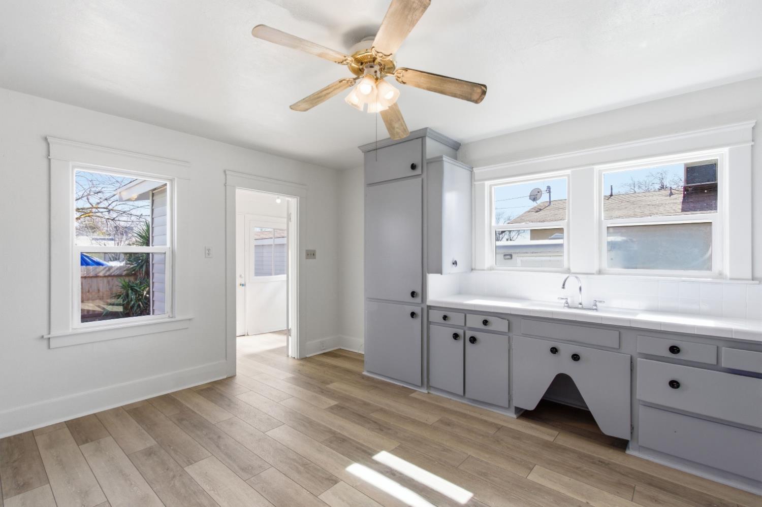 1014 3rd Street Los Banos, CA 93635 - Photo 8 of 21 a spacious bathroom with a double vanity sink a mirror and a shower