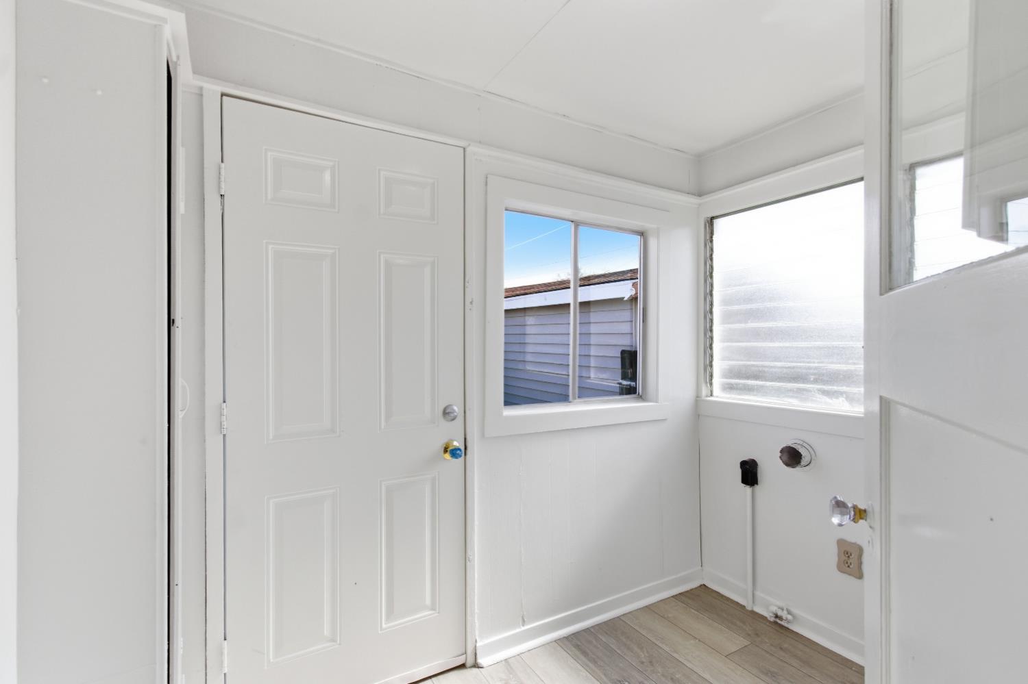 1014 3rd Street Los Banos, CA 93635 - Photo 10 of 21 a view of small space with wooden floor and windows
